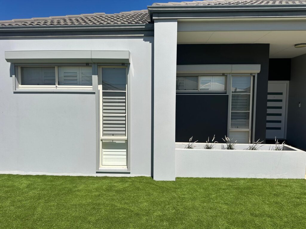 Contemporary Perth home with grey roller shutters - servicing maintains performance